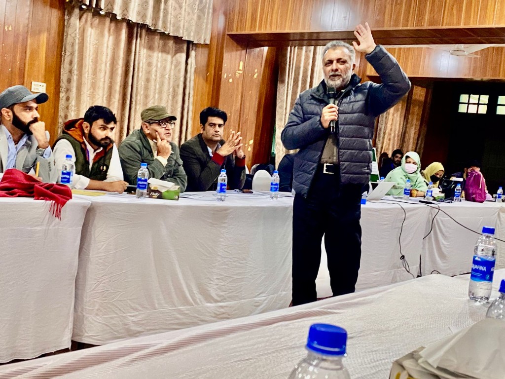 ACT facilitator addressing participants at a community meeting and workshop in Pakistan